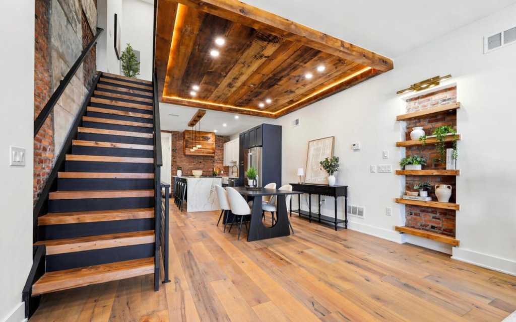 Newly installed wide-plank hardwood floors with a natural finish