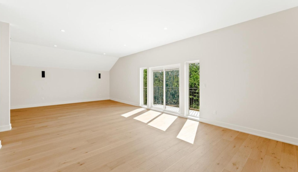 Freshly installed hardwood flooring in a bright room